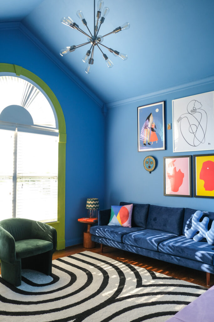 modern blue room with gallery wall art