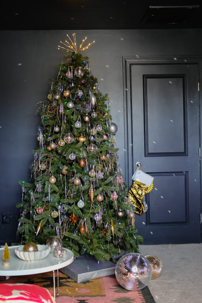 Christmas tree decorated using metallic colors and tinsel