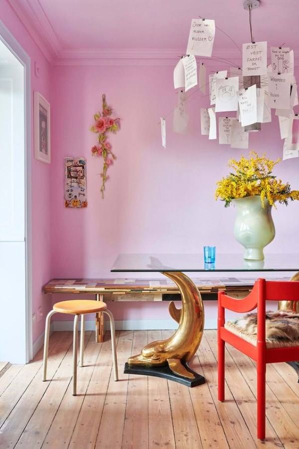 dining room with pink walls