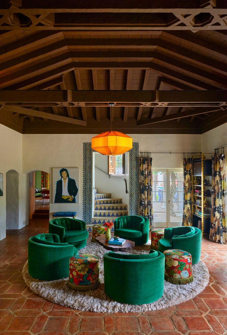 beautifully appointed living room with green chairs