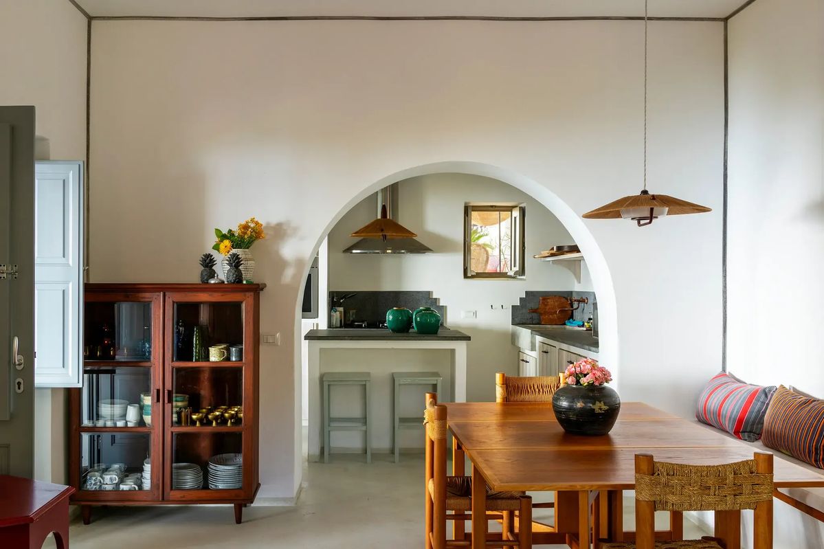 wood furnishings in kitchen with arch