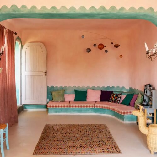 beautiful color and pattern combo in this gorgeous living room-also loving the arch detail and scalloped painting technique