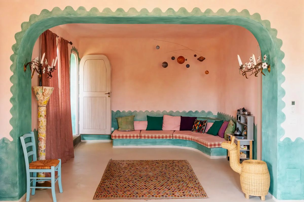 beautiful color and pattern combo in this gorgeous living room-also loving the arch detail and scalloped painting technique