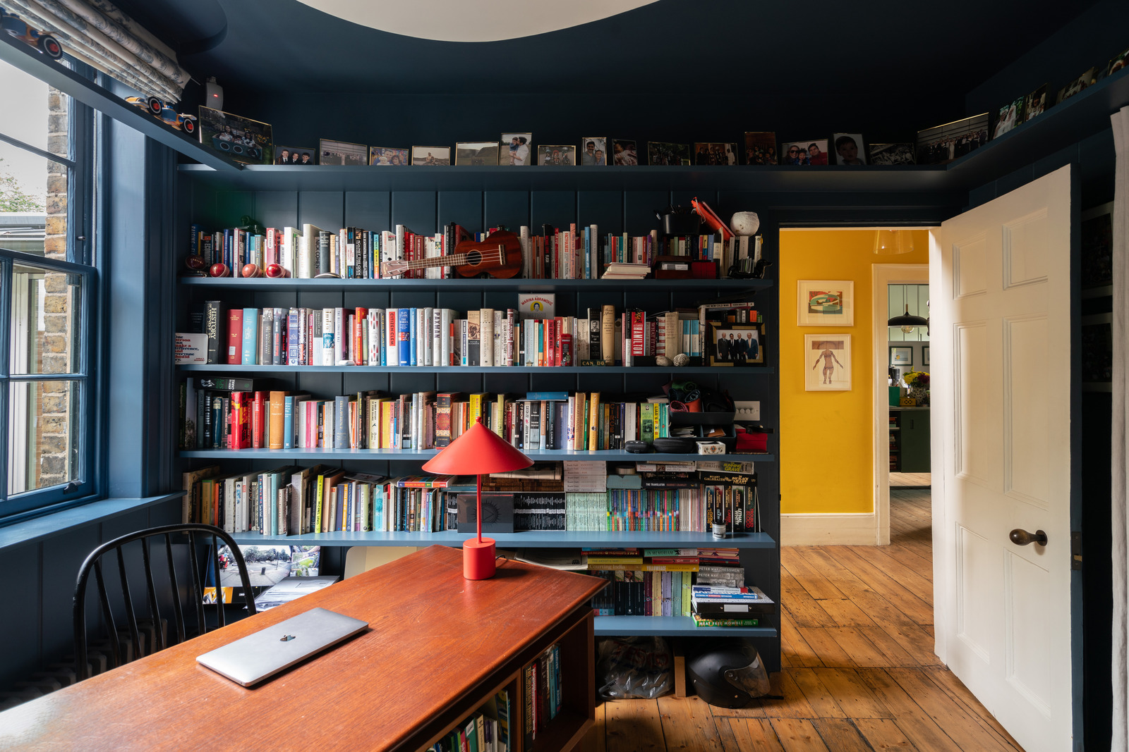 color drenched walls and bookcase 