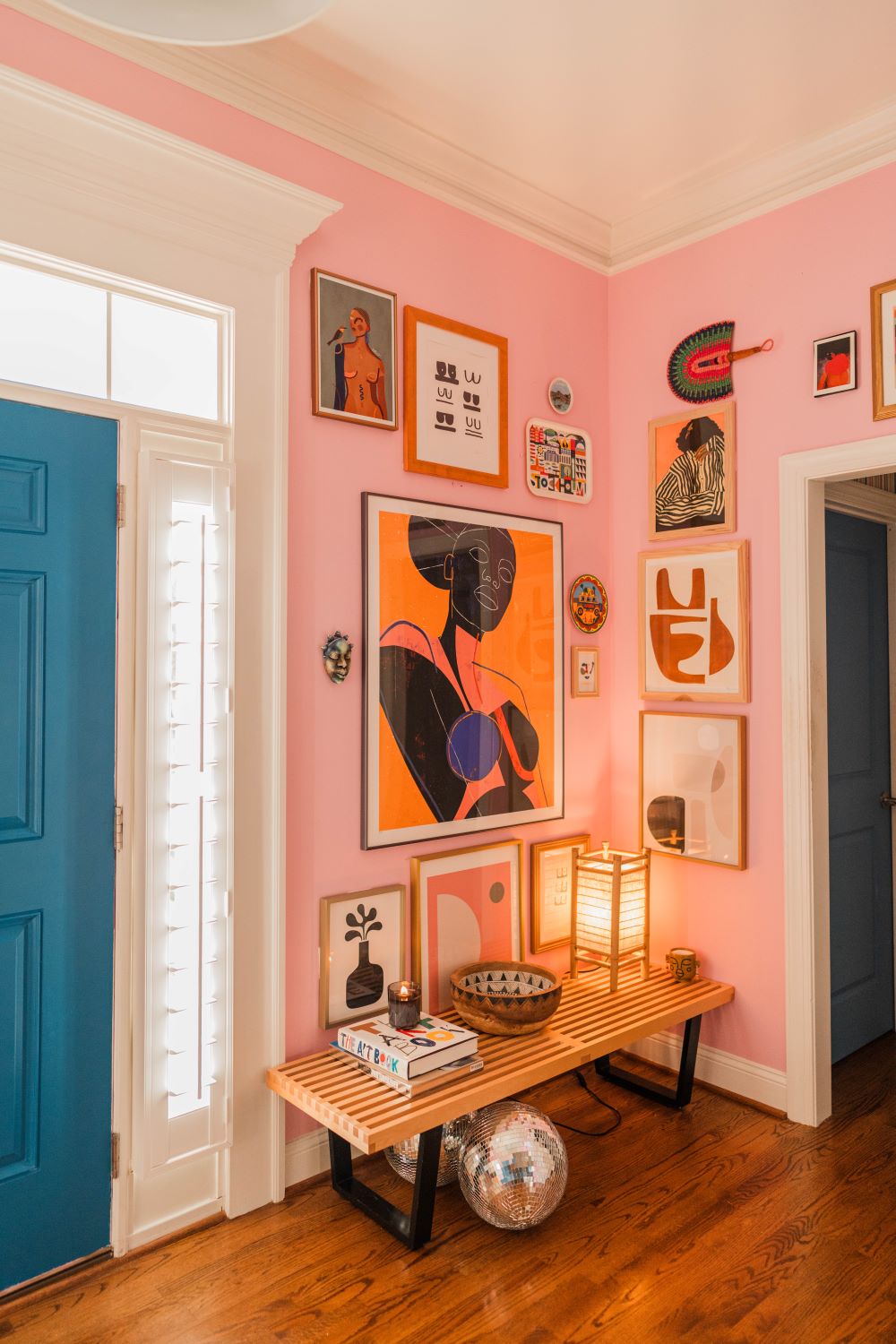 colorful and fun gallery wall in foyer