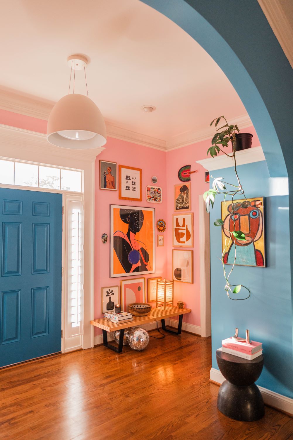 colorful and fun gallery wall in foyer