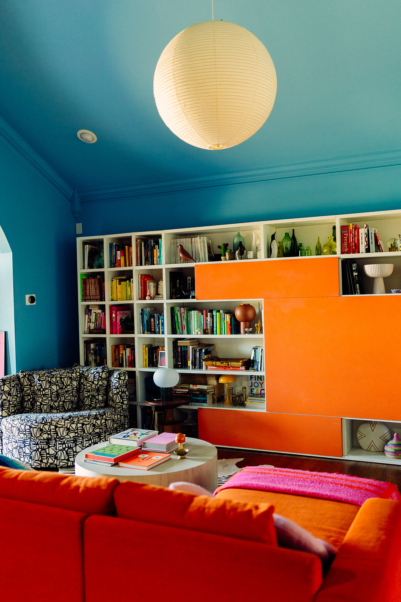 Italian bookcase in color drenched living room