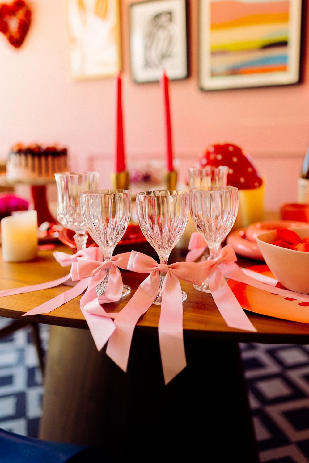 pink ribbons on thrifted glasses for fun barbiecore galentine's day party