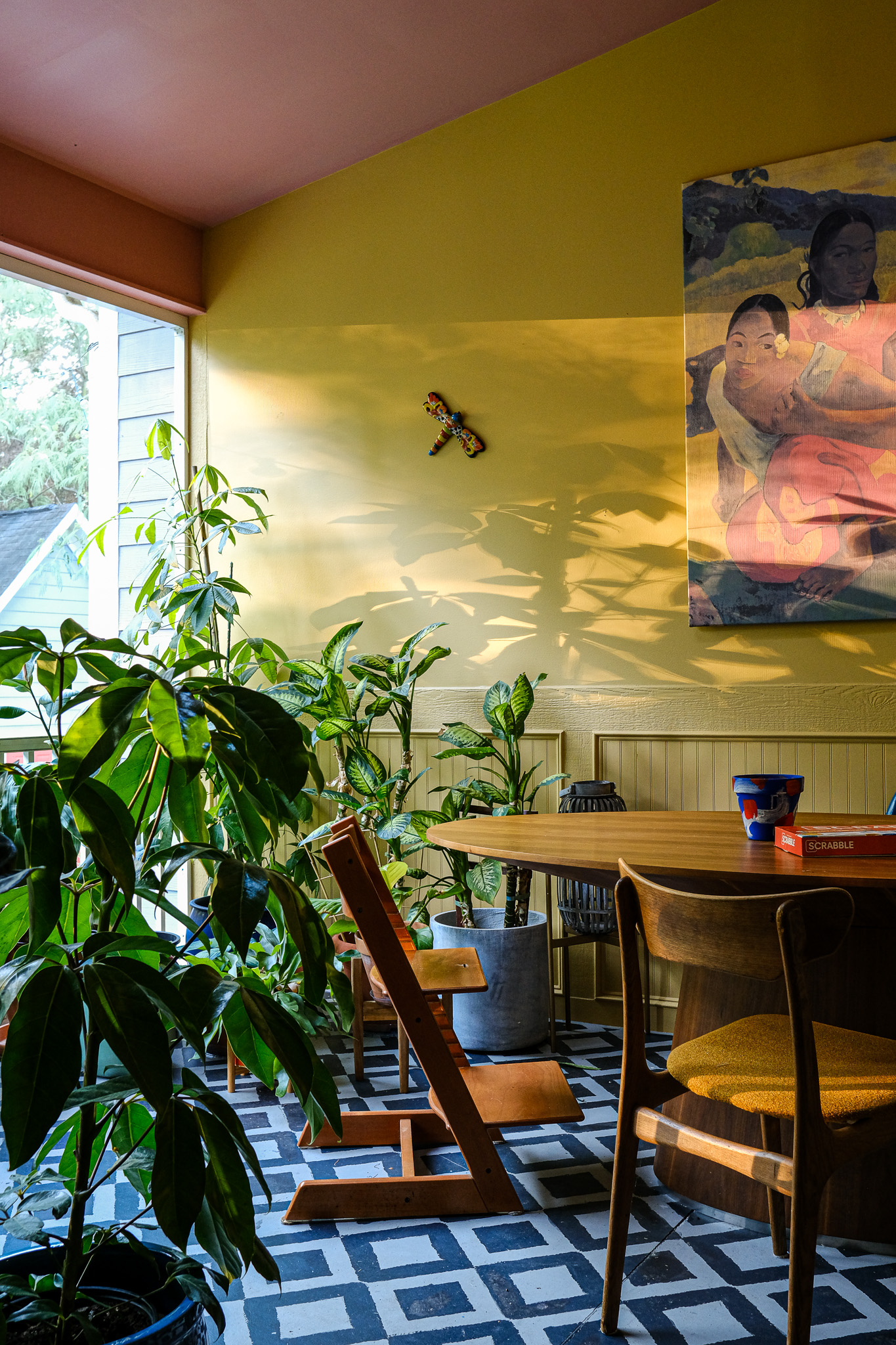 butter yellow porch with plants