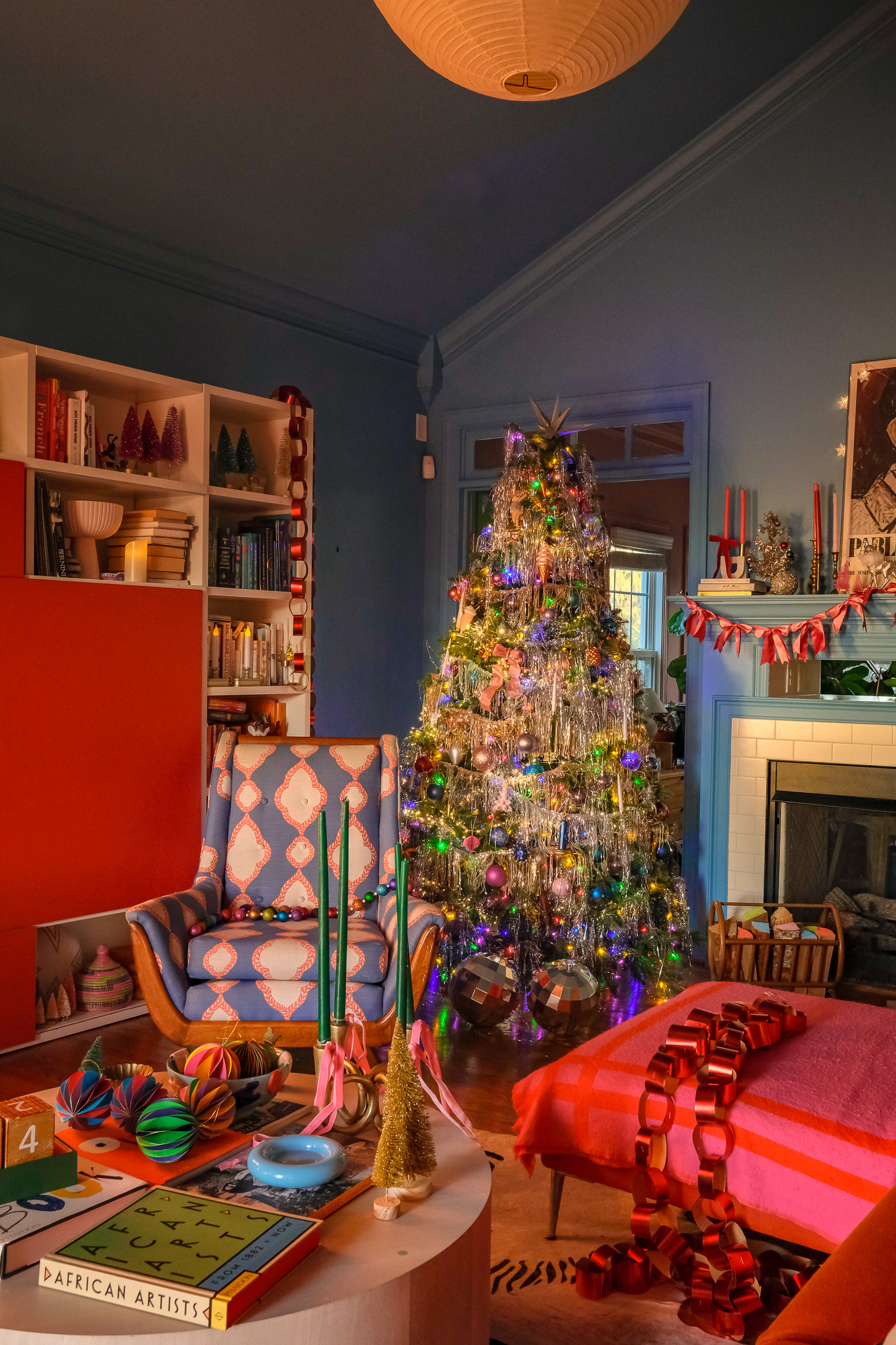 cozy living room decorated for christmas, tinsel christmas tree