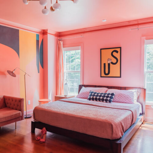 pink bedroom with modern mural