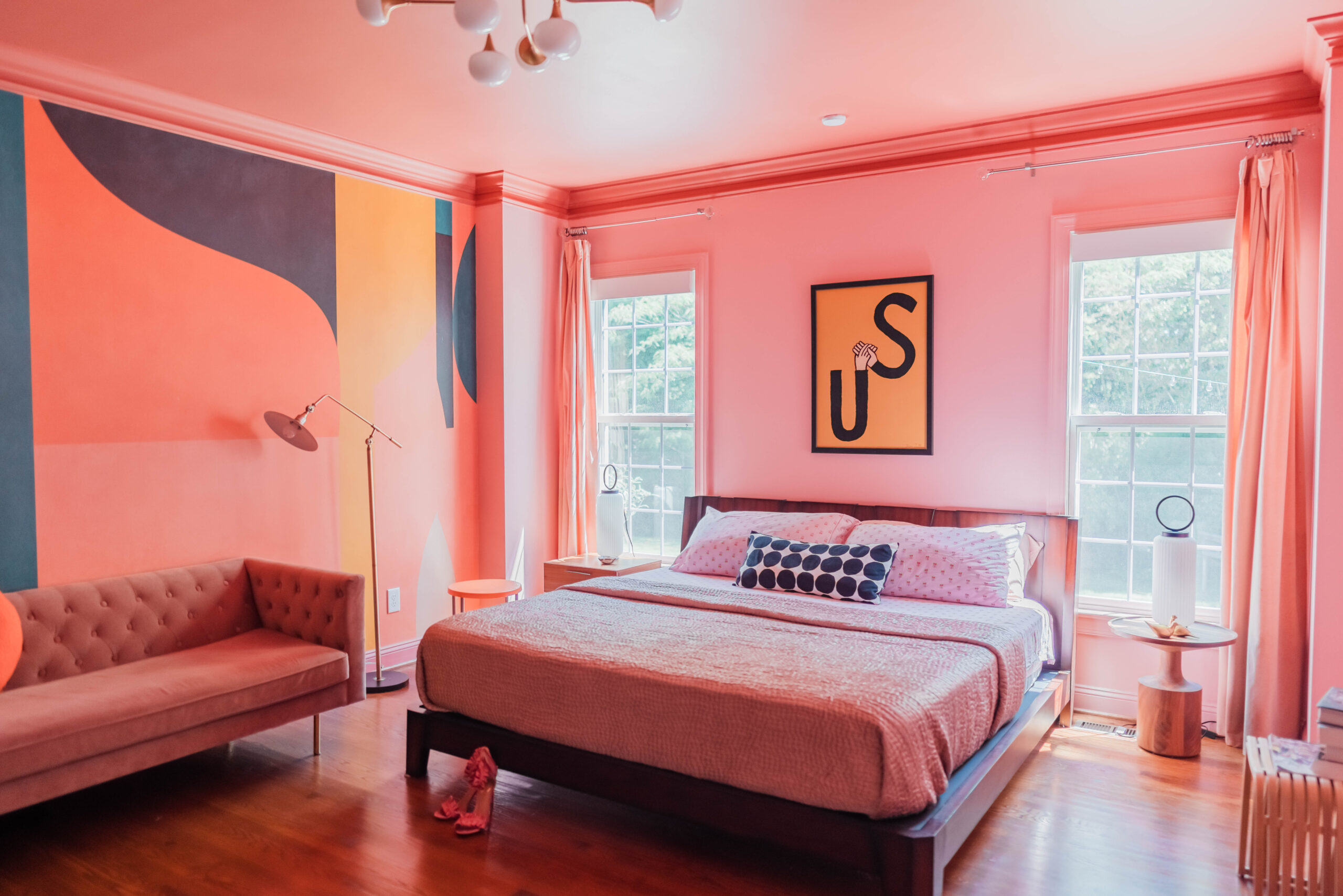 pink bedroom with modern mural