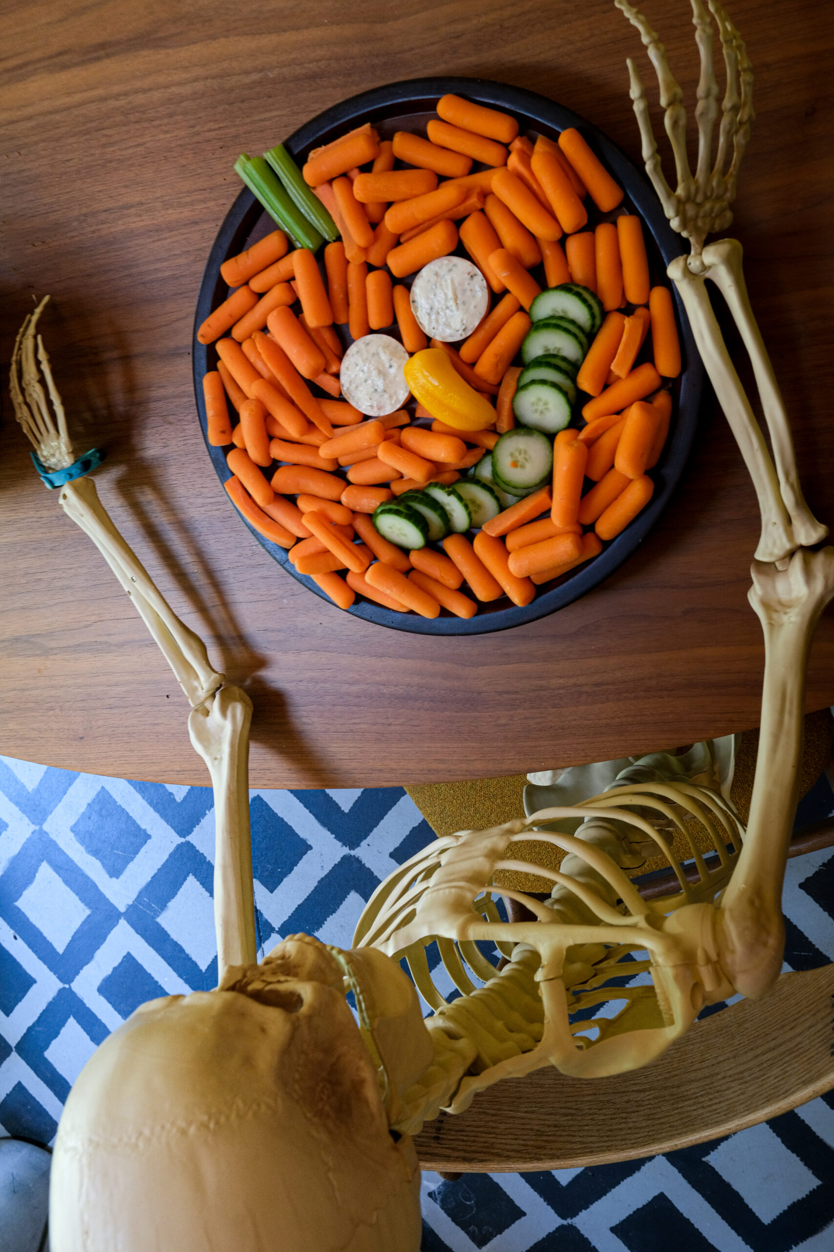 pose and stay skeleton with veggie charcuterie board